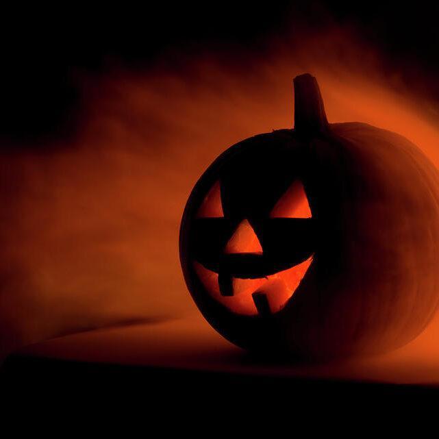 a scary halloween pumpkin in smoke ilonabudzbon