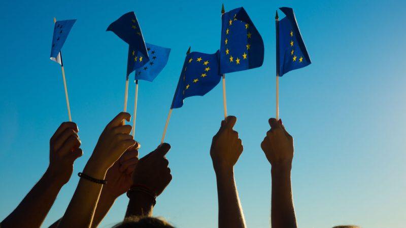EU flags young people CREDITDenisFilm Shutterstock x EU flags young people CREDITDenisFilm Shutterstock x