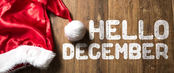 Hello December written on wooden background with Santa Hat Hello December written on wooden background with Santa Hat